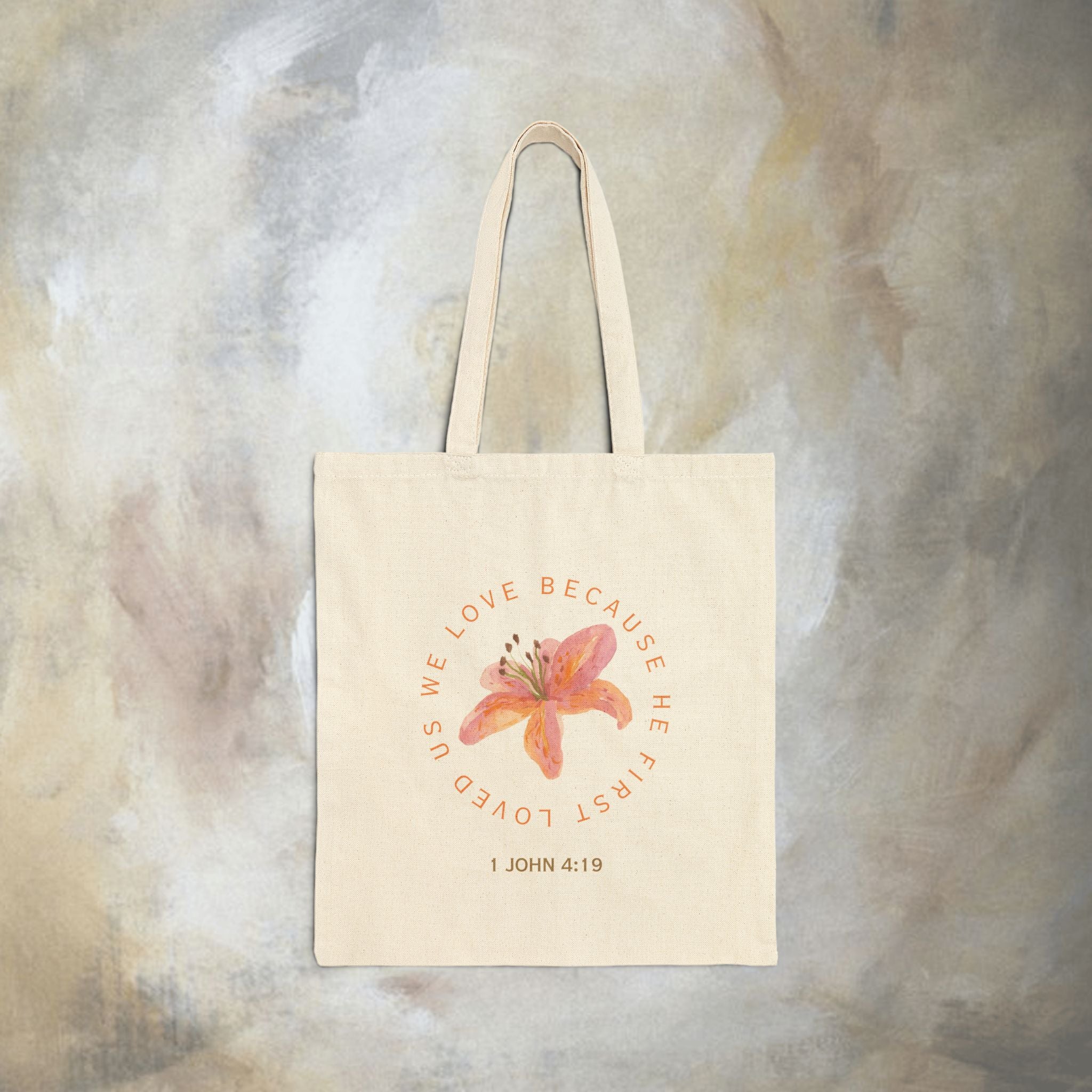 We love because he first loved us tote bag