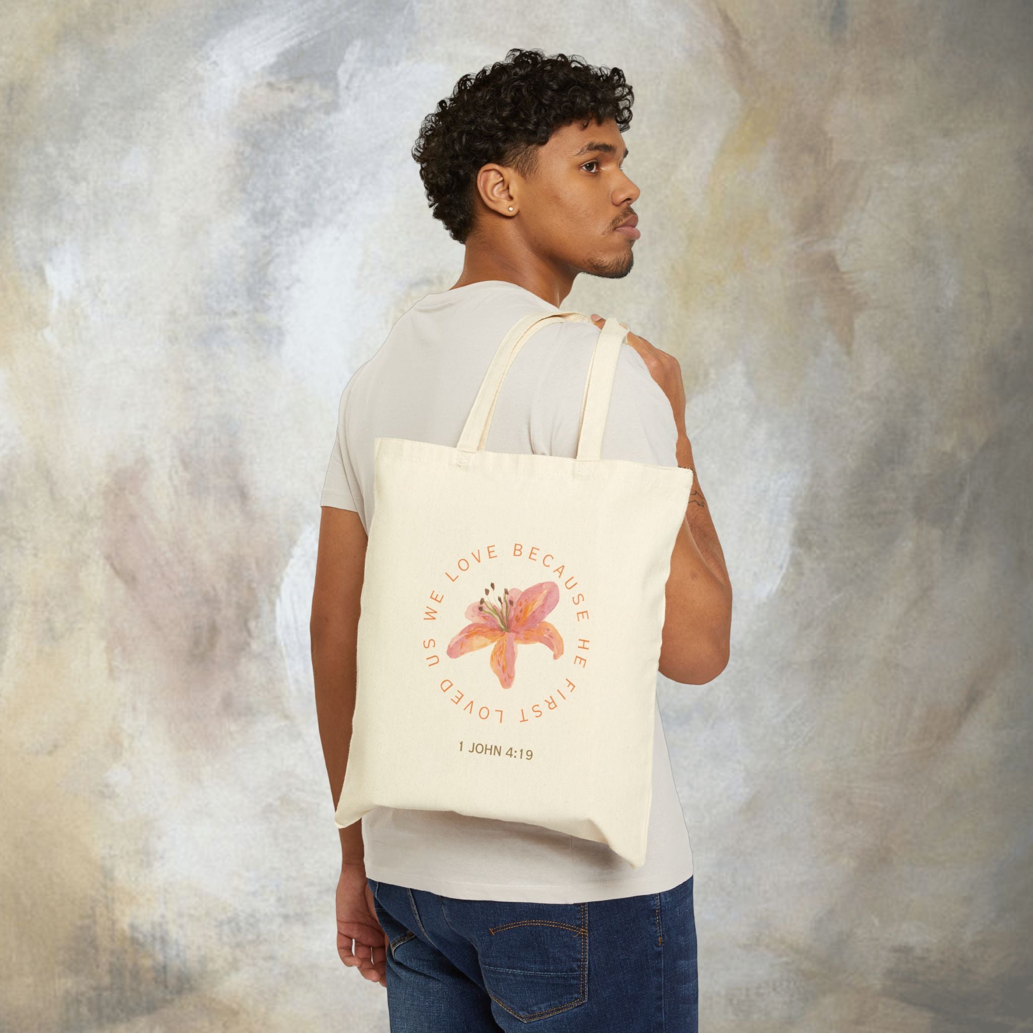 We love because he first loved us tote bag