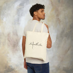We love because he first loved us tote bag